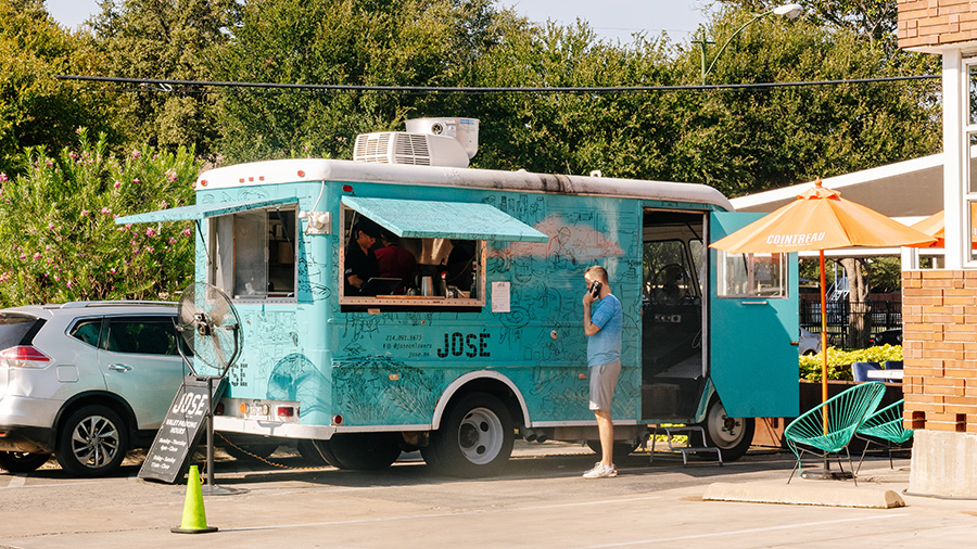 Individual buying tacos at Teatro Café