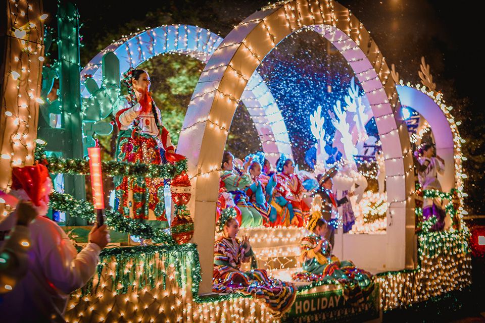 Children and gifts on a Christmas parade float