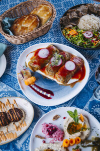 Beautifully plated Turkish cuisine, including stuffed cabbage.