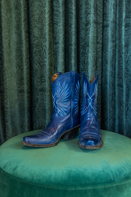 A pair of deep blue cowboy boots