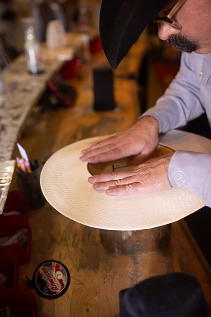 The Best Hat Store shapes a custom hat.