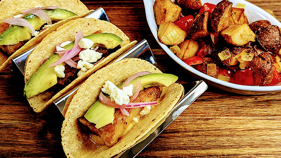 Pork belly tacos with avocado and cheese