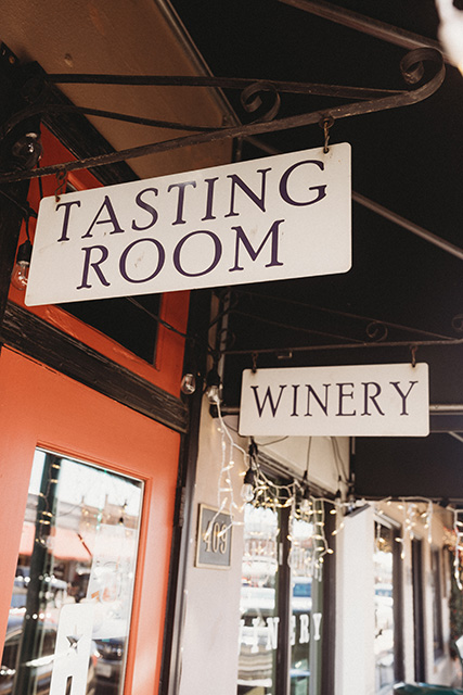 Signs invite visitors into the winery's Tasting Room