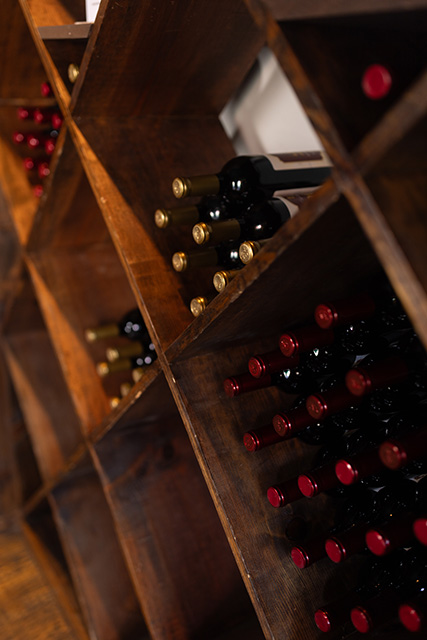 Wine bottles are displayed on a shelf