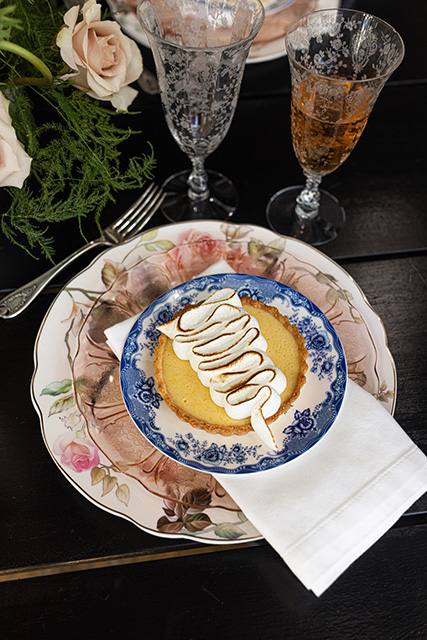 Vintage dishes topped with a dessert