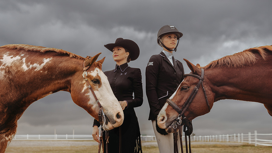 Payton Boutelle and Ashleigh Scully stand with their horses.